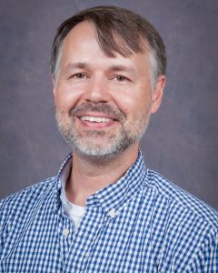 Dr. Mark Elliott smiling.