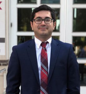 Peyman Abbaszadeh standing outside of a building.