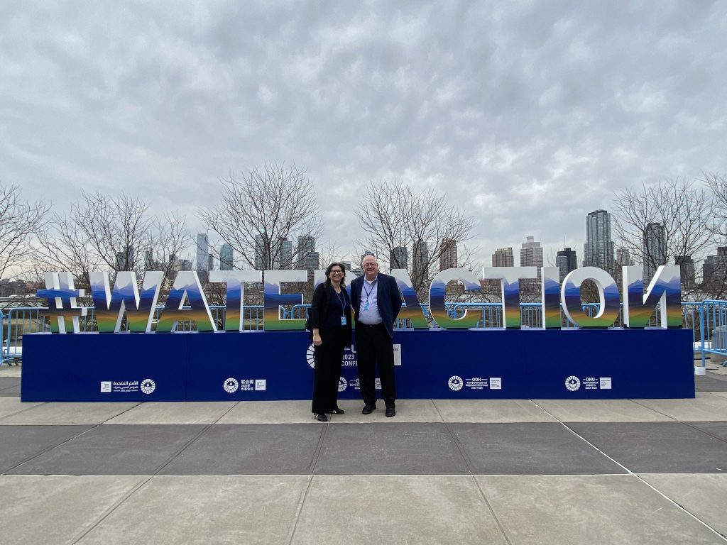 Dr, Kate Brauman and Mike Gremillion in front of UN water conference display. #wateraction