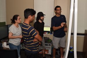 A group of Summer Institute participants working together, discussing solutions for water prediction and flood forecasting.