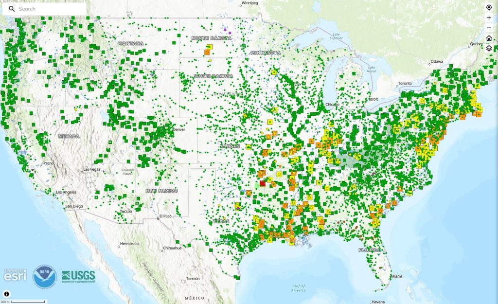 Map of the United States showing the locations of monitored NWS water gauges under the National Water Prediction Service, with numerous colored icons indicating gauge locations and statuses.