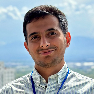 Portrait of Savalan Naser Neisary smiling outdoors