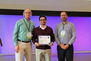 Savalan Naser Neisary, center, holds his Student Developer Award certificate while standing with Steve Burian, left, and Sagy Cohen, right, at the 2025 CIROH Developers Conference.