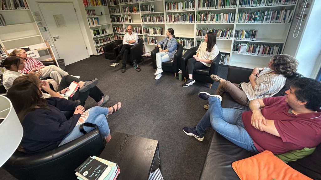 UA students meet with Rachel Carson Center director Dr. Christof Mauch in Munich, Germany, during their international water science collaboration.