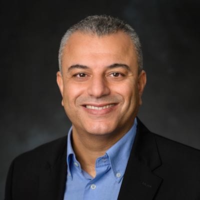 Dr. Marouane Temimi smiling in a professional headshot, wearing a dark jacket and light blue shirt.