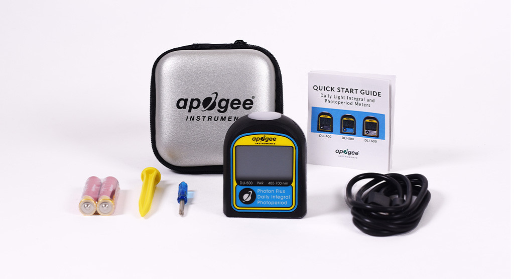 Apogee DLI-500 full-spectrum quantum sensor kit with handheld meter, carrying case, batteries, cable, and user guide, used for measuring light intensity and photoperiod.