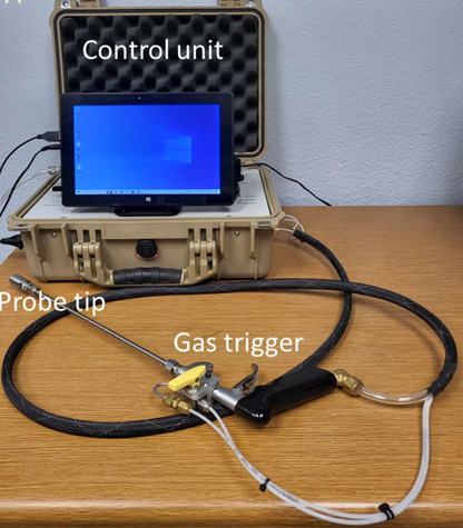 Laboratory setup showing the CoreLabs PPP-250TM probe permeameter with labeled control unit, probe holder, and gas trigger, used to measure rock and soil permeability.