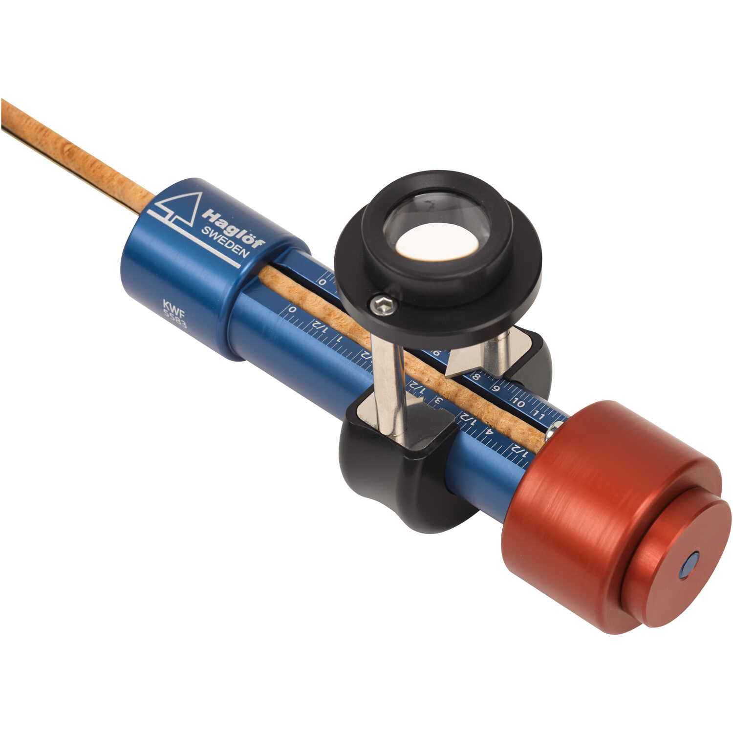 Haglöf tree-core reader with blue and red metal housing and magnifying lens, used to examine tree-ring samples for growth and hydrologic research.