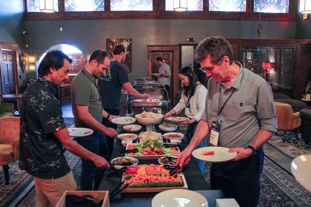 Networking event attendees gathering for food, chatting and more, with guest appearance from Big Al.