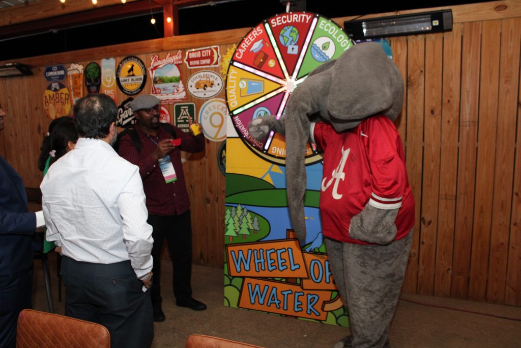 Networking event attendees gathering for food, chatting and more, with guest appearance from Big Al.