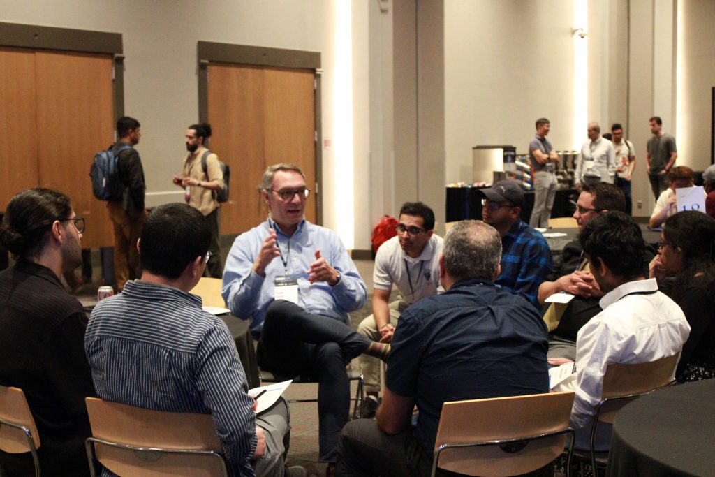 Researchers and professionals share ideas and insights during breakout discussions.