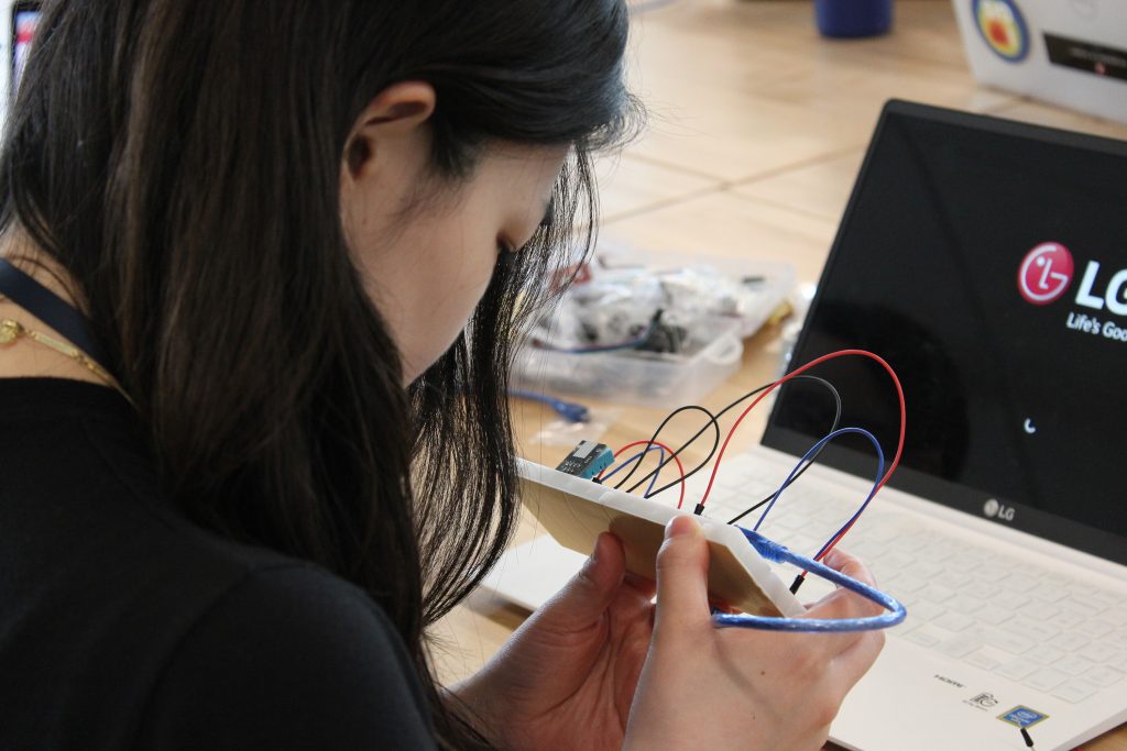 UA FLOW Academy students working with specific equipment - Arduino, Raspberry Pi, or sensors in USGS HIF lab.