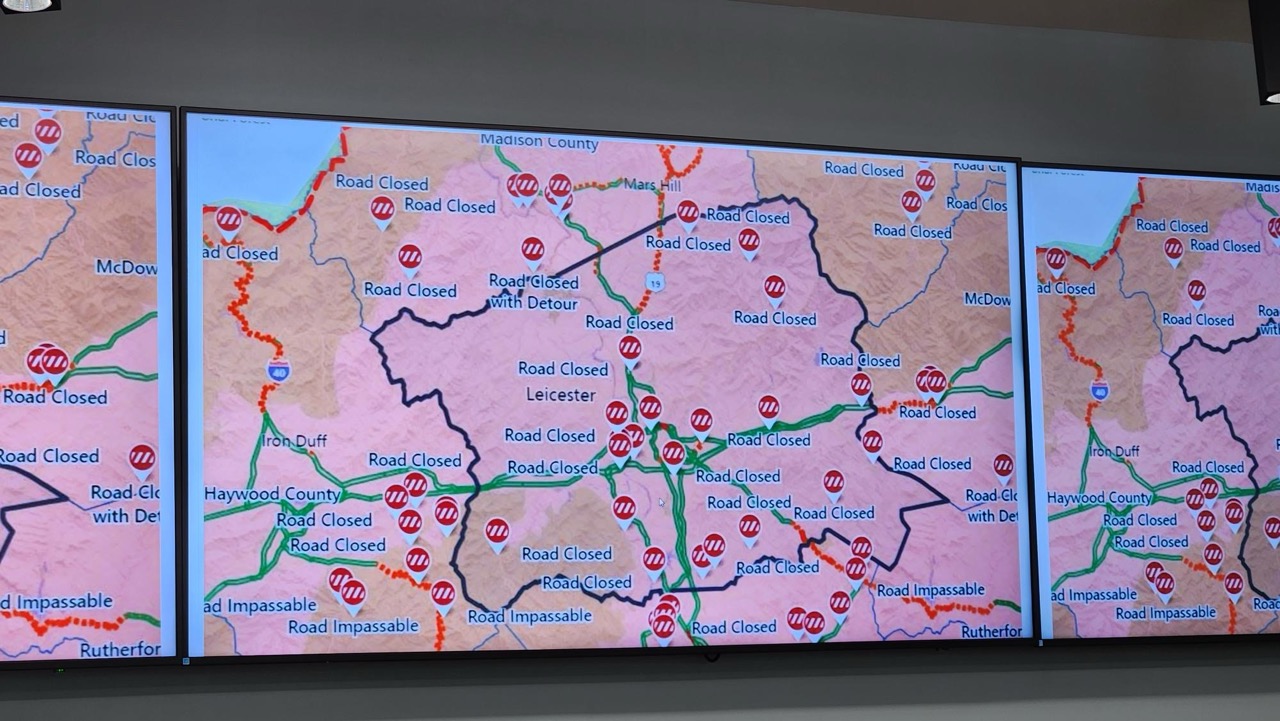 Map showing road closures and impassable routes across multiple counties, with closed roads marked by red lines and "Road Closed" labels and impassable roads indicated by blue labels.